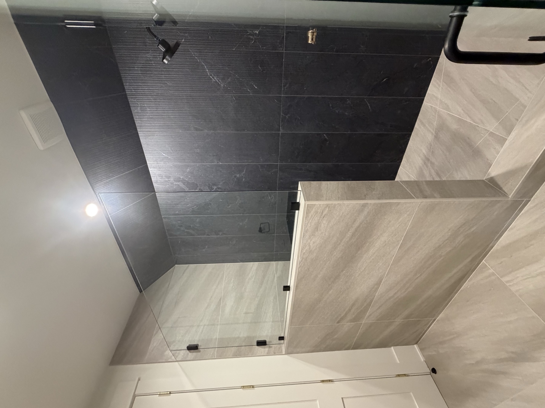 Custom black slate walk-in shower built by Luxury Interiors LLC